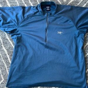 Sweet Arc'teryx cycling shirt in a steel blue. Great shape.